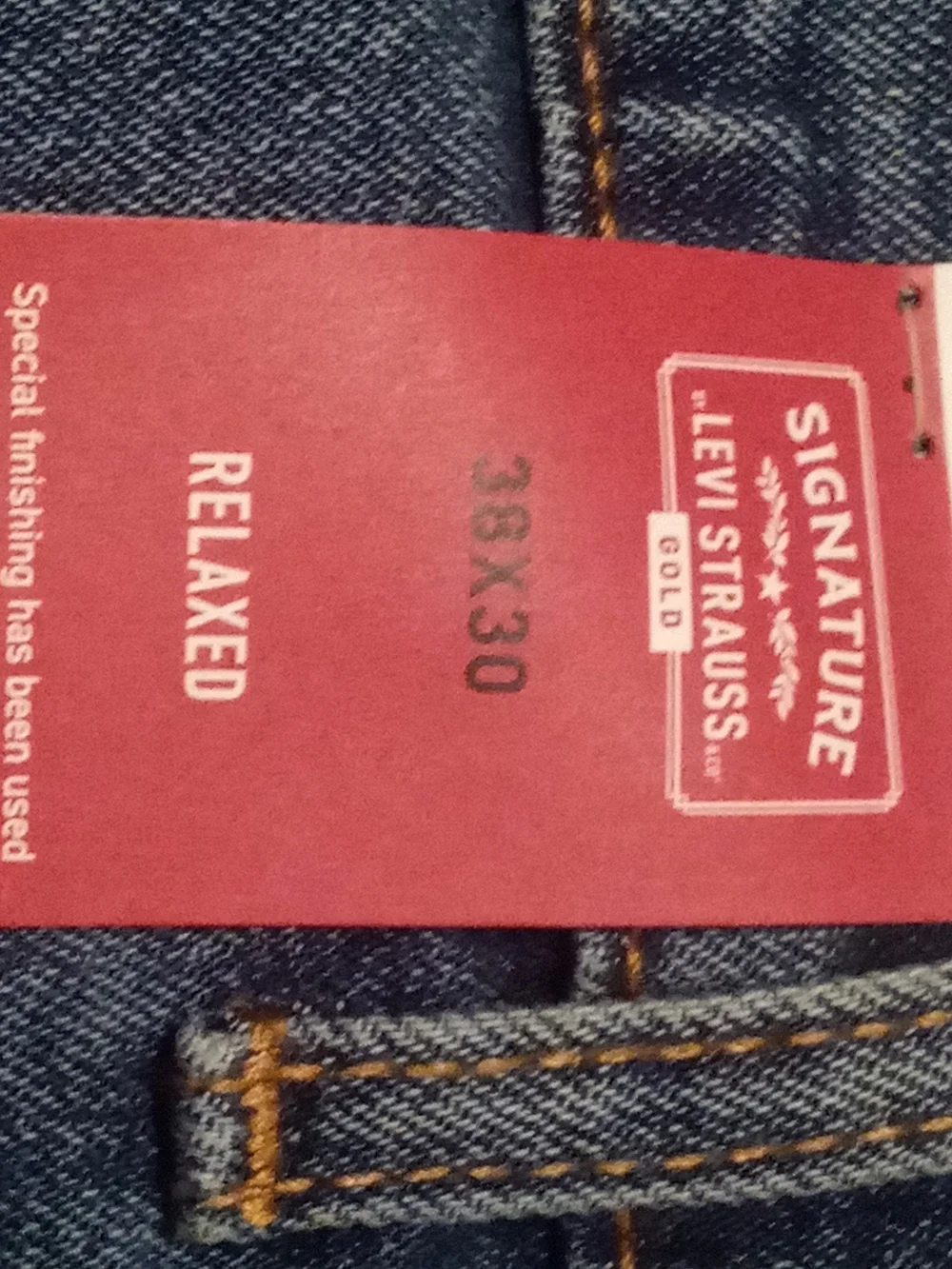 Levi's Signature Relaxed Fit Jeans in Blue with Brown Patch